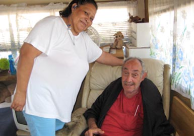 Caretaking woman and elderly man